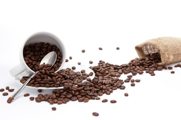 Overturned Coffee Beans and Cup Isolated on White Background with copy space