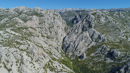 The Velika Paklenica karst river canyon is within national park, Velebit, Croatia. It is famous for hiking and free climbing on huge rock faces. 