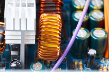 Microchip, capacitors, resistors on a computer board. Industrial background.