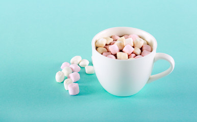 Marshmallow over drink in cup over bright