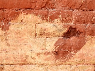Texture of old brick wall painted brown in natural environment