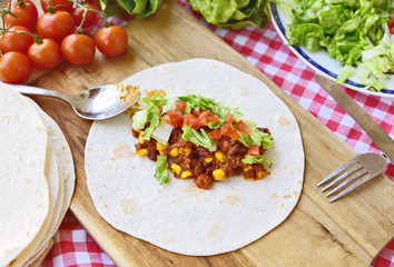 Chili Con Carne Burrito with fresh vegetable.
