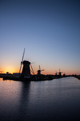 Windmill at kinderdijk at sunset - 228893421