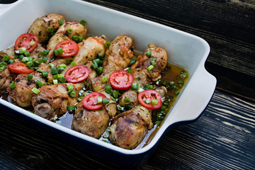 Roasted chicken legs with spices , close-up