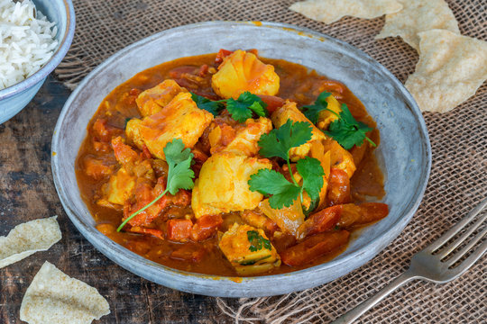 Fish Mappas - Kerala style coconut fish curry with rice. It's a popular dish in southern Indian state of Kerala.