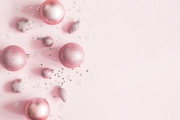 Christmas composition. Christmas pink decorations on pastel pink background. Flat lay, top view, copy space