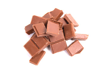 Milk chocolate pieces isolated on white background