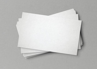 White business card stack on concrete desk 3D rendering