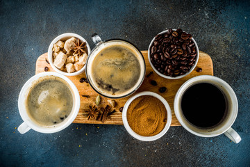 Obraz na płótnie Canvas Coffee cups with beans and ground coffee