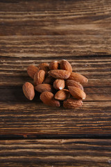 Almonds on the wooden background