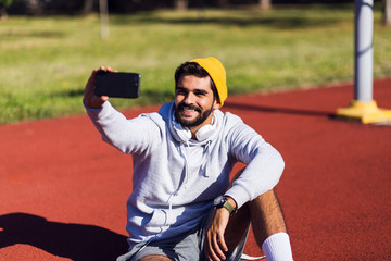 Fitness young man take selfie outdoor