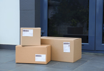 Parcel boxes on floor near office entrance