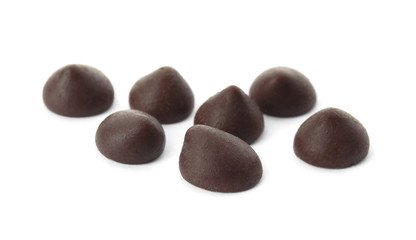 Delicious dark chocolate chips on white background