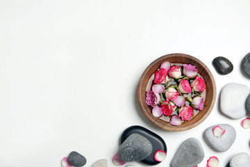 Flat lay composition with spa stones and space for text on white background