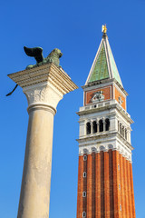 Fototapeta na wymiar View of St Mark's Campanile and Lion of Venice statue at Piazzetta San Marco in Venice, Italy