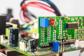 electrical board with electronic components, close up blurry background