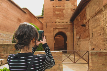 Building of moorish architecture, beautiful orange clay walls and details.