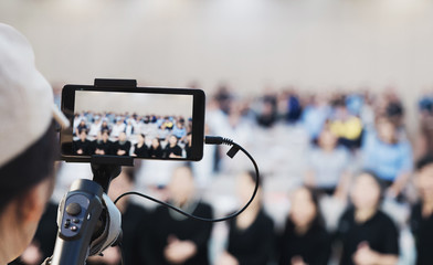 Gimbal (Smartphone Gimbal holding on hand for recording footage and photo.