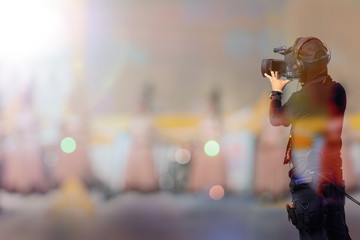 professional cameraman on stage to record event