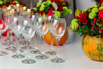 wine glasses on the table for drinks (close-up partial view). Festive crystal