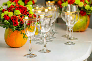 wine glasses on the table for drinks (close-up partial view). Festive crystal