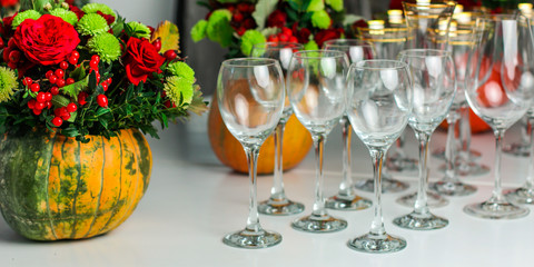 wine glasses on the table for drinks (close-up partial view). Festive crystal