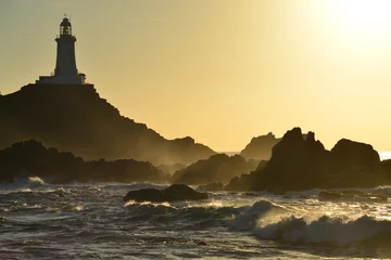 Crédence de cuisine en verre imprimé Phare La Corbiere lighthouse, Jersey, U.K.  Autumn storms and a coastal structure.