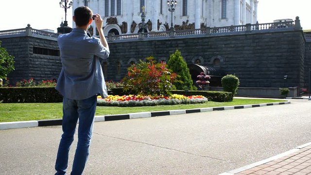 Person takes pictures of sights on a smartphone