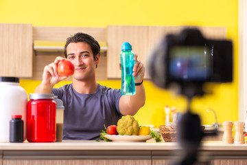 Young man blogging about food supplements
