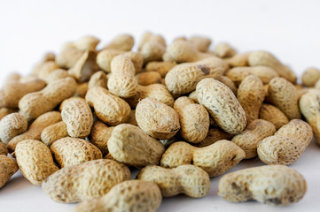 Unpeeled peanuts isolated