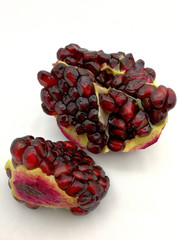 Pomegranate grains on white background