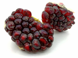 Pomegranate grains on white background