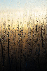 water drops on sunrise window glass