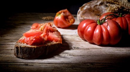 Tomatoes and bruschetta with tomatoes