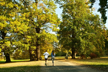 couple jogging in the autumn park