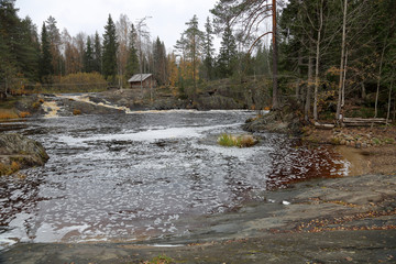 Scenic Karelian waterfall Ahvenkoski in autumn. Russia
