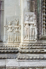 Bas-relief with the devatas adorning the walls of the main complex of Angkor Wat