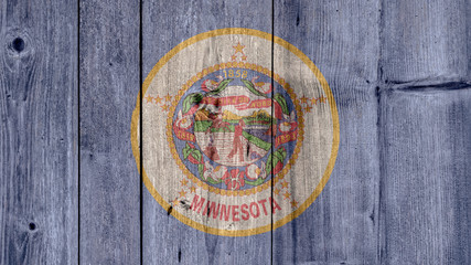 Obraz na płótnie Canvas USA Politics News Concept: US State Minnesota Flag Wooden Fence