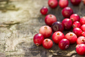 Cranberries on a wooden table.