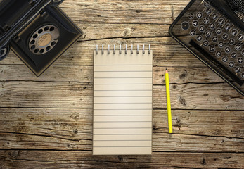 Vintage typewriter, telephone and a blank sheet of paper, retro retouching