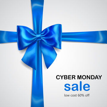Blue bow with crosswise ribbon with shadow and inscription Cyber Monday Sale on white background