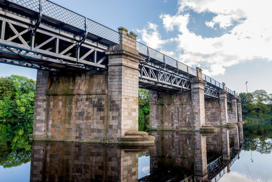 A view of scenic railway bridge crossing river Dee near Duthie park, Aberdeen, Scotland