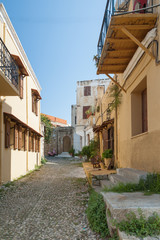 Fototapeta na wymiar Residential alley and dwellings in old town. Rhodes, Old Town, Island of Rhodes, Greece, Europe.