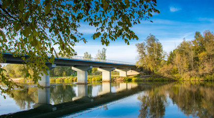 Obraz premium Scenic view of the bridge on reinforced concrete piers at sunset.