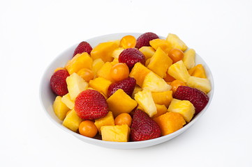 Bowl of healthy fresh fruit salad on white marble background. healthy food.