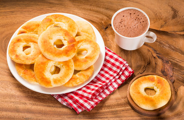 Pandequeso traditional Colombian food - Hot drink chocolate.Top view