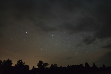 Starry sky through the clouds