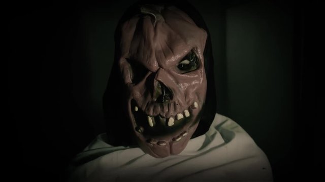 Pumpkin mask ghost with jump scare moment