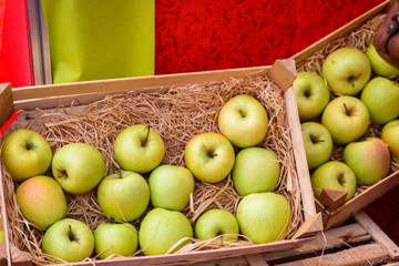 A crate of ripe green apple