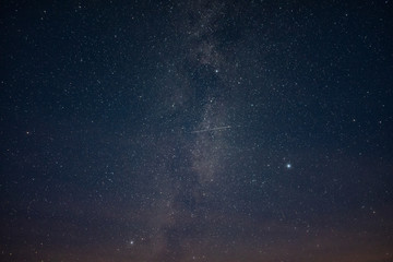 Starry sky through the clouds